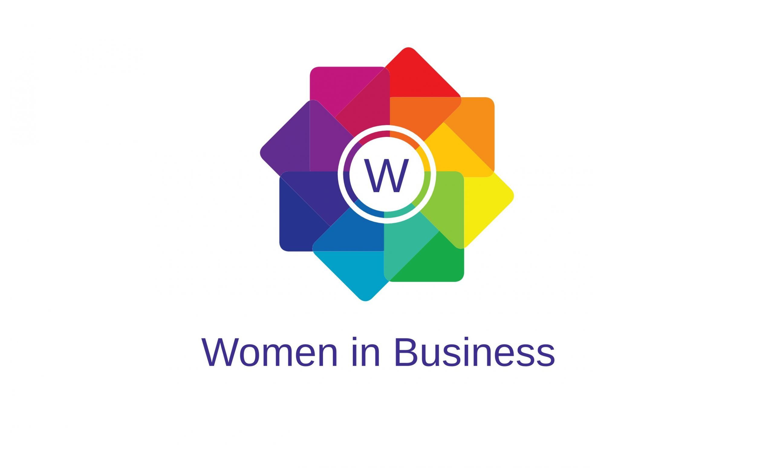 A colorful logo featuring a multi-colored geometric flower with overlapping petals in various colors. The flower's center contains a white circle with a 'W' inside. Below the logo, text reads "Women in Business" in purple. The background is white, symbolizing the vibrant community of Women in Business Bristol.
